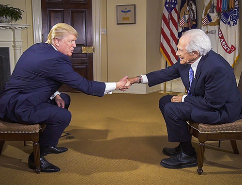 President Trump shaking the hand of CBN Founder Pat Robertson