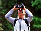daily Devotion woman outdoors looking through binoculars