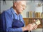 man whittling