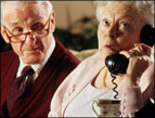 Before Cell Phones elderly couple using land-line telephone