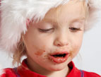 christmas toddler with chocolate mess on her face