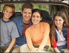 daily Devotion picture of family sitting in the opened rear of their vehicle