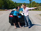 couple at crossroads arguing about directions