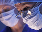 surgeon wearing scrubs and surgical mask