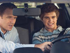 father son driving instruction tense situation