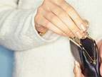 woman getting coins from change purse