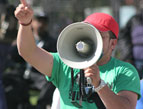 protestor with a loud speaker bull horn