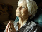 senior woman praying