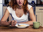 woman eating cereal