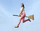 woman riding a broom
