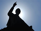 silhouette of man preaching